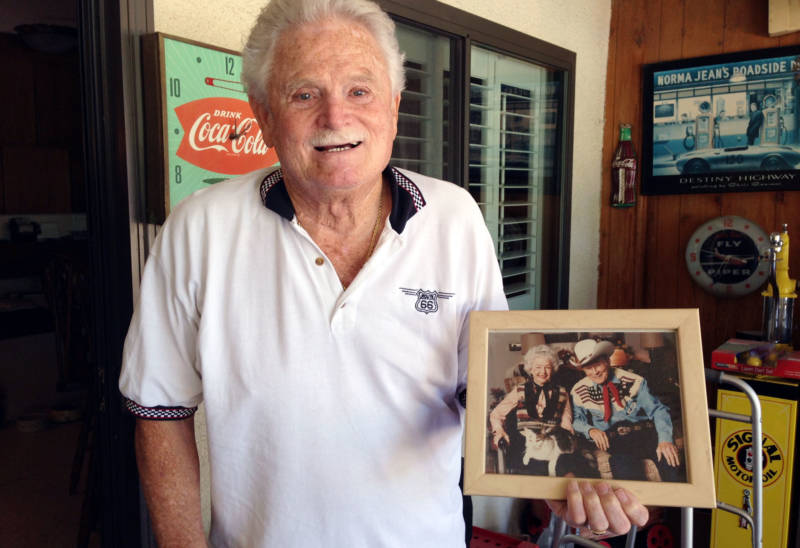 Cecil Stevens holds a photo of neighbors Roy Rogers and Dale Evans.