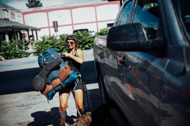 Emily Rothman of Florida throws her pack into a truck that will take her to a friend’s pot farm in Garberville. She said all the women she knows have been warned of things to watch out for when coming to the area for work.