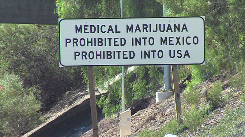 A sign on the southbound Interstate 5 warns against smuggling marijuana into Mexico or the United States.