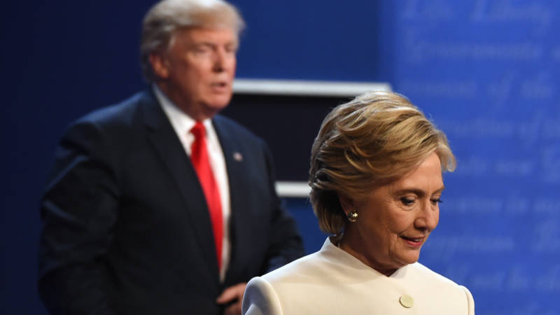 Hillary Clinton and Donald Trump walk off stage Wednesday after the third and final presidential debate at the University of Las Vegas in Las Vegas, Nev.