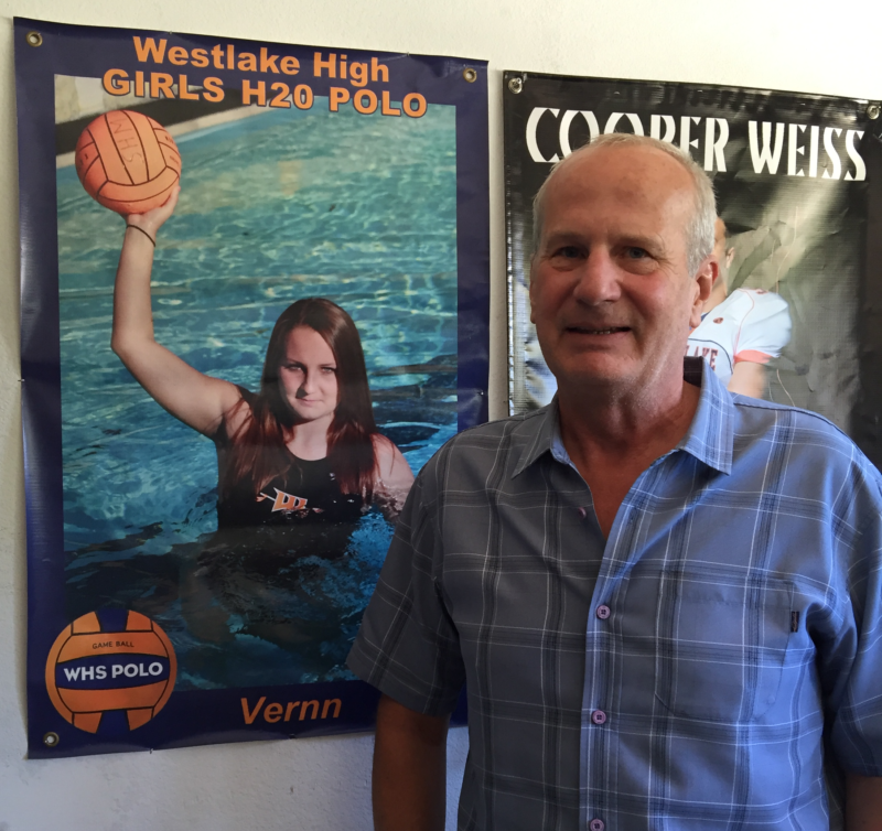 Bob Weiss with a poster of his daughter, Veronika, who was killed in a mass shooting near UC Santa Barbara in 2014. He's campaigning for Proposition 63. 