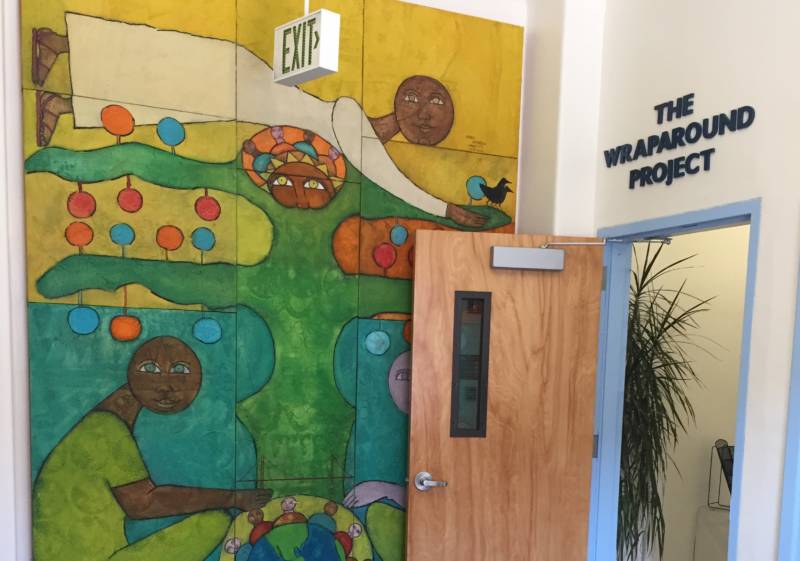 A mural, painted by the father of a former client, marks the entrance to The Wraparound Project at Zuckerberg San Francisco General Hospital and Trauma Center.