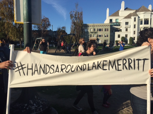 People gathered on Saturday, Nov. 12, to hold hands around Lake Merritt in Oakland to protest the election of Donald Trump as president.