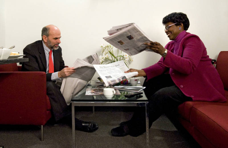 Gerald Seib (L) and Gwen Ifill go over the news before filming ABC's This Week at the Newseum in Washington, D.C., in December 2008.