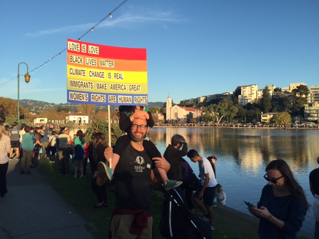 People gathered on Saturday, Nov. 14, to hold hands around Lake Merritt in Oakland to protest the election of Donald Trump as president.