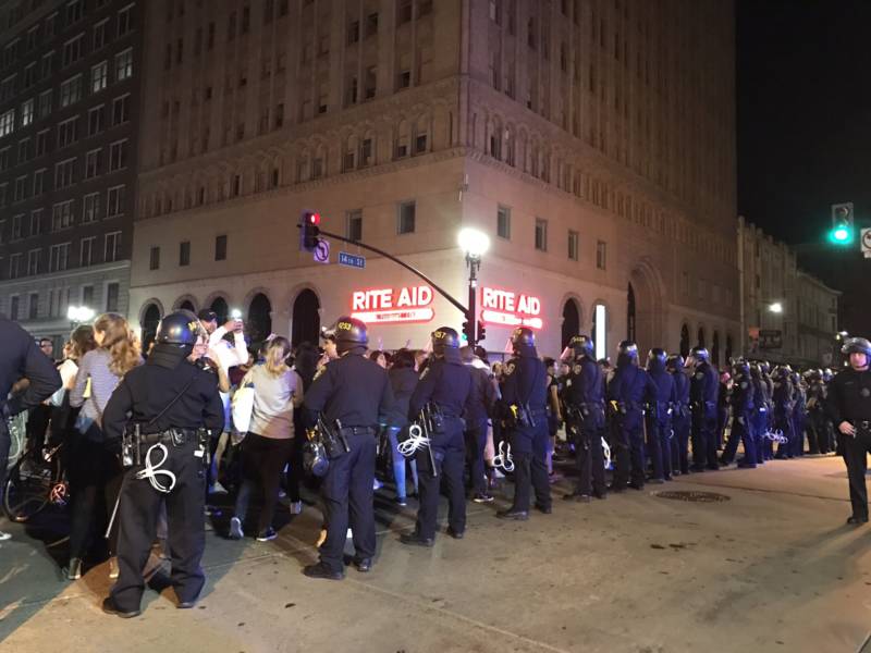 Police and protesters faced off at 14th Street and Broadway in downtown Oakland early Wednesday morning. 