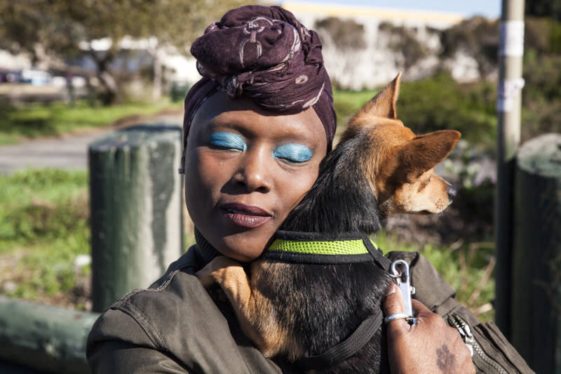  Jernika Robinson hugs her dog King after his check up at the Vet S.O.S clinic in San Francisco, California. Robinson was relieved to have a clean bill of health for her puppy. “We do everything together.” Say Robinson as she hugs King. 