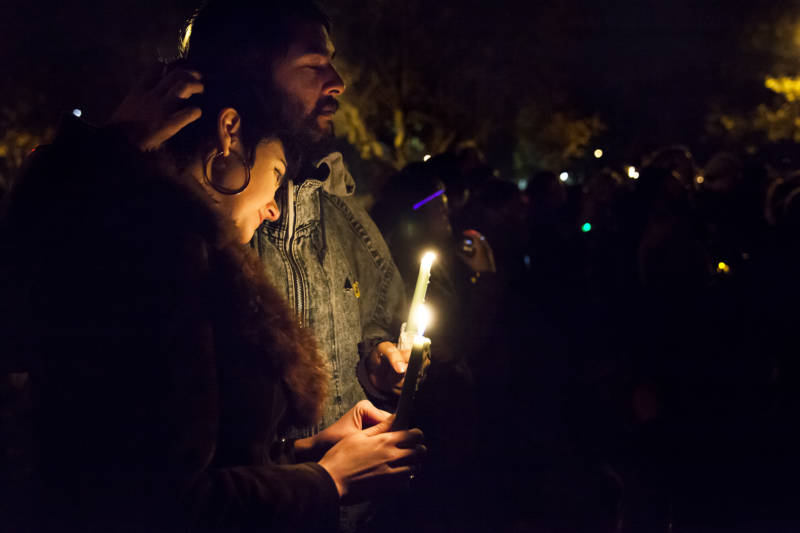 Whitney (left) and Simi console each other during the candlelight vigil in Oakland in honor of the victims of the Oakland Ghost Ship fire. 