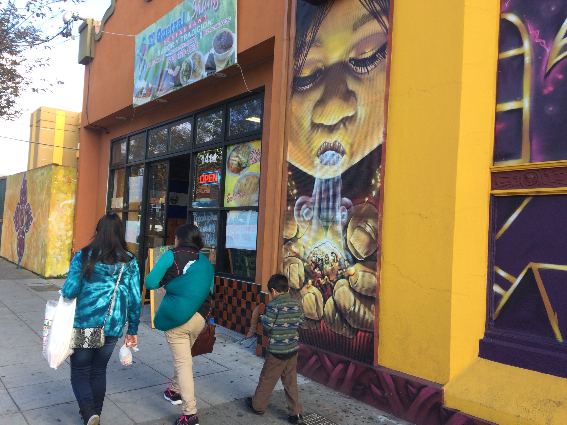 A mural by the Eastside Arts Collective is one of many that decorate stores and other buildings on Fruitvale Ave. The neighborhood has become home to many artists, say long time residents.