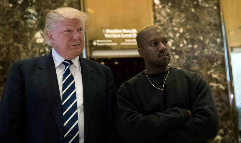 President-elect Donald Trump and Kanye West pose for a picture Tuesday in the lobby of Trump Tower in New York.