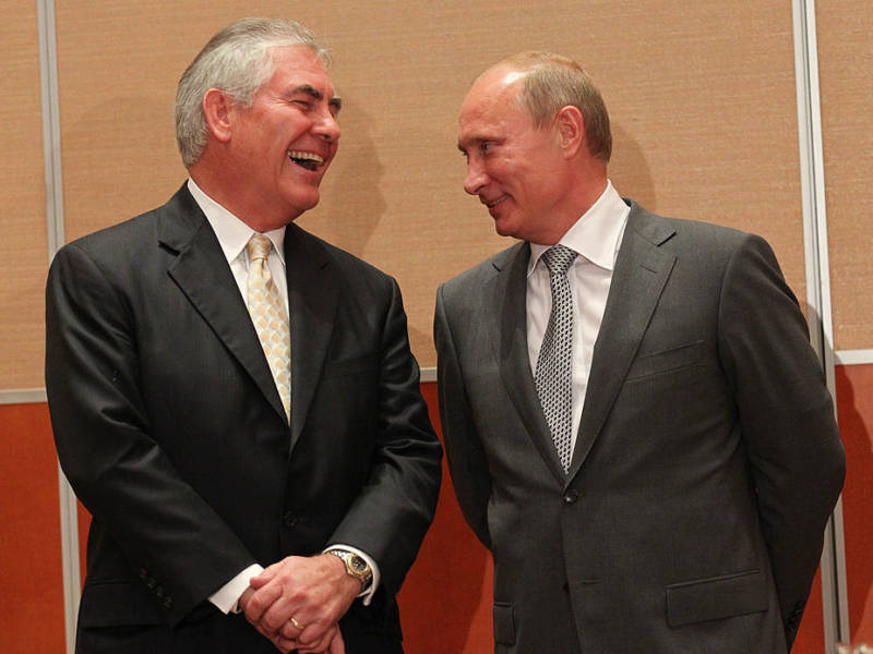 Russian President Vladimir Putin and Rex Tillerson, chairman and CEO of Exxon Mobil, share a laugh during a signing ceremony for an arctic oil exploration deal between Exxon Mobil and Rosneft in August 2011.