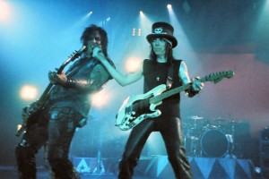 Nikki Sixx and Mick Mars performing in 2005. Image via Wikipedia Commons.