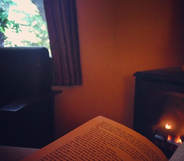 Heaven is a Sunday morning read in front of a fireplace in one of Fernwood's motel rooms 