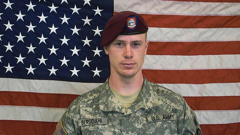 UNDATED - In this undated image provided by the U.S. Army, Sgt. Bowe Bergdahl poses in front of an American flag.