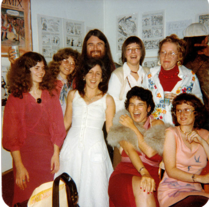The women of Wimmen's Comix at a gallery show of their work in 1975, with Last Gasp publisher Ron Turner.