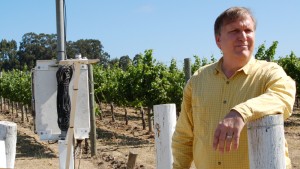 David Graves, co-owner of Saintsbury Winery, in the Carneros region of the Napa Valley, an area known for the quality of its Pinot Noir wines. Graves stands next to a weather station that monitors conditions in his vineyards. (Photo by Joan Johnson Miller/KQED, 2007).