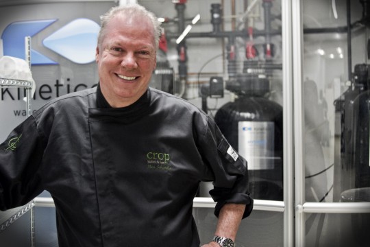 Chef Steve Schimoler of Crop Bistro, in front of his water filtration system.