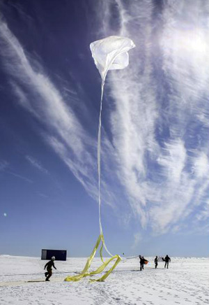 The BARREL team launches one of 20 research balloons over Antarctica. (Photo: NASA/S. Spain)