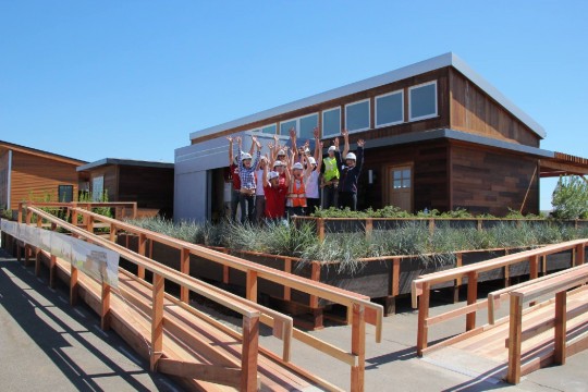The Stanford Solar Decathlon team celebrates after reassembling its house in Irvine just two days before the competition. Photo courtesy Stanford Solar Decathlon