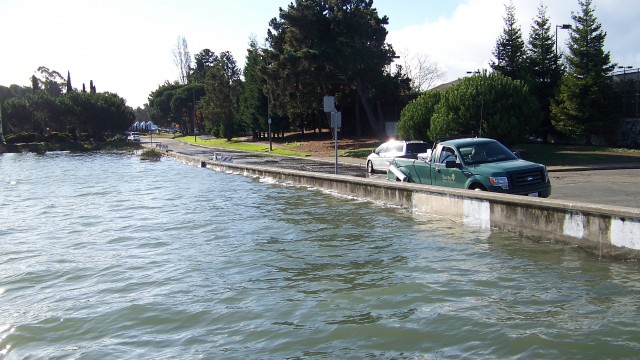 Last December the King Tide brought high water very close to the top of a containment wall in Alameda.  Photo courtesy of East Bay Regional Park District.