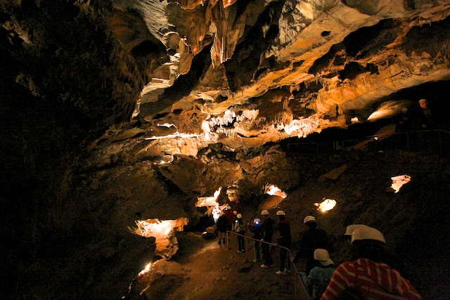 A tour group explores California Cavern.
