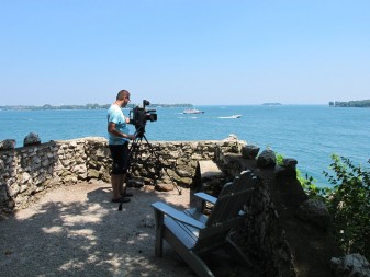 Videographer Milan Jovanovic takes in the expanse of lake and islands visible from Perry’s Lookout. Credit: Jean O’Malley