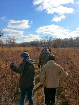 Visitors to the Aldo Leopold Nature Center learn about Prairie Grasses.  Photo courtesy of Margaret Broeren