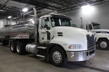 Two 5,000 gallon tanker trucks deliver cheese plant wastewater to GreenWhey Energy.   