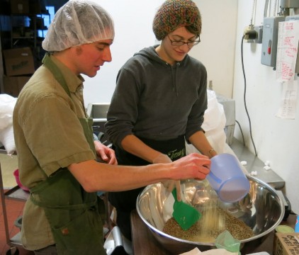 Plant Kingdom owner Jeremy Koosed and employee Laura B mix ingredients for hemp-based baked goods. Credit: Anne Glausser, ideastream
