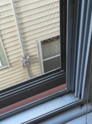 Window gaps, like this one, can be a major source of air and water leakage.