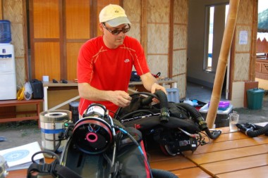 Bart Shepherd, the Director of the Steinhart Aquarium, preps his rebreather gear before heading out on a five-hour dive into the twilight zone.