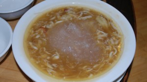 At Koi Palace, in Daly City, a chicken and pork broth is topped with a translucent paste made with rehydrated swallows' nests. The dish, called bird's nest soup, has replaced shark fin soup at banquets.