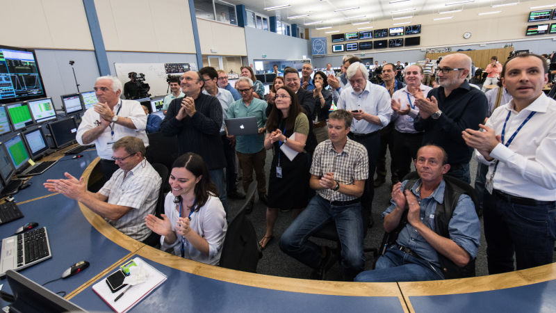 Researchers at the Large Hadron Collider in Switzerland celebrate in June after the powerful atom smasher started a series of experiments in which particles collided at double the energy level ever recorded.