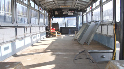 An empty Muni bus, before it is converted to mobile showers