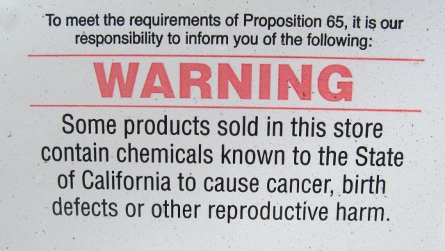 Prop. 65 warning posted outside of a San Francisco auto parts store. (Mike Osborne/KQED)