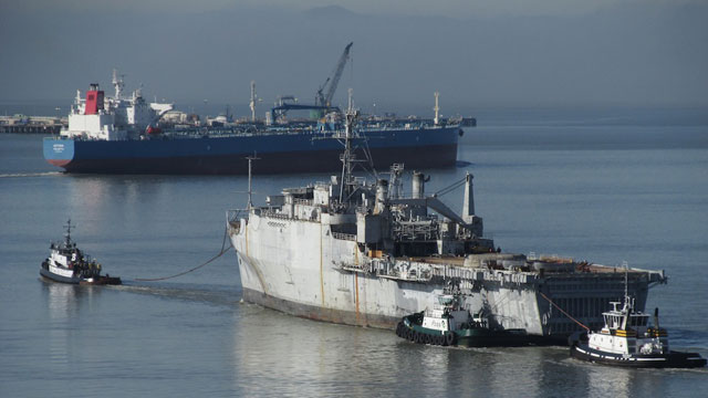 After having its hull scoured at Mare Island, retired Navy support ship is under tow, on its way to a Texas scrapyard. (Craig Miller)