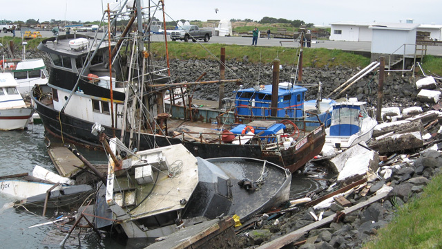 Wreckage piled up by the 2011 tsunami that hit Crescent City's harbor. (Craig Miller/KQED)