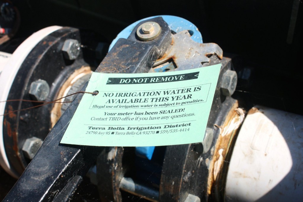 The Terra Bella Irrigation District has put a physical seal on the spigots that deliver water to farmers. There is a $10,000 penalty for breaking the seal. (Sasha Khokha/KQED)