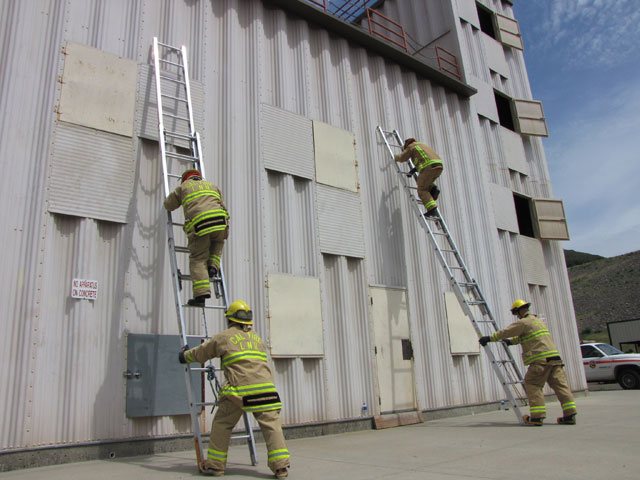 CalFire firefighters running through drills at a training facility in Napa County. (Molly Samuel/KQED)