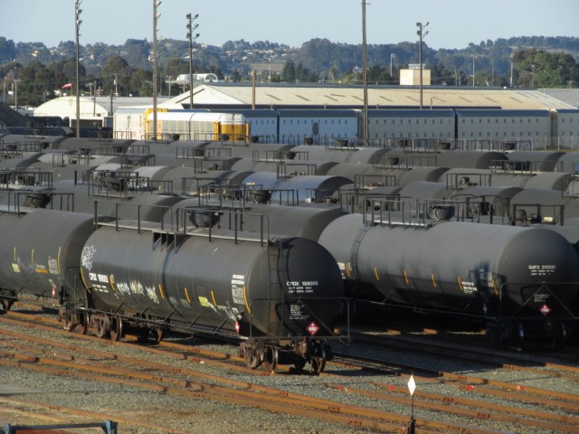 Tank cars lined up in a rail yard in Richmond. (Craig Miller/KQED)