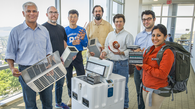 LBNL Institute for Globally Transformative Technologies research team with prototype vaccine fridge and backpack for developing countries. (Berkeley Lab / Roy Kaltschmidt)