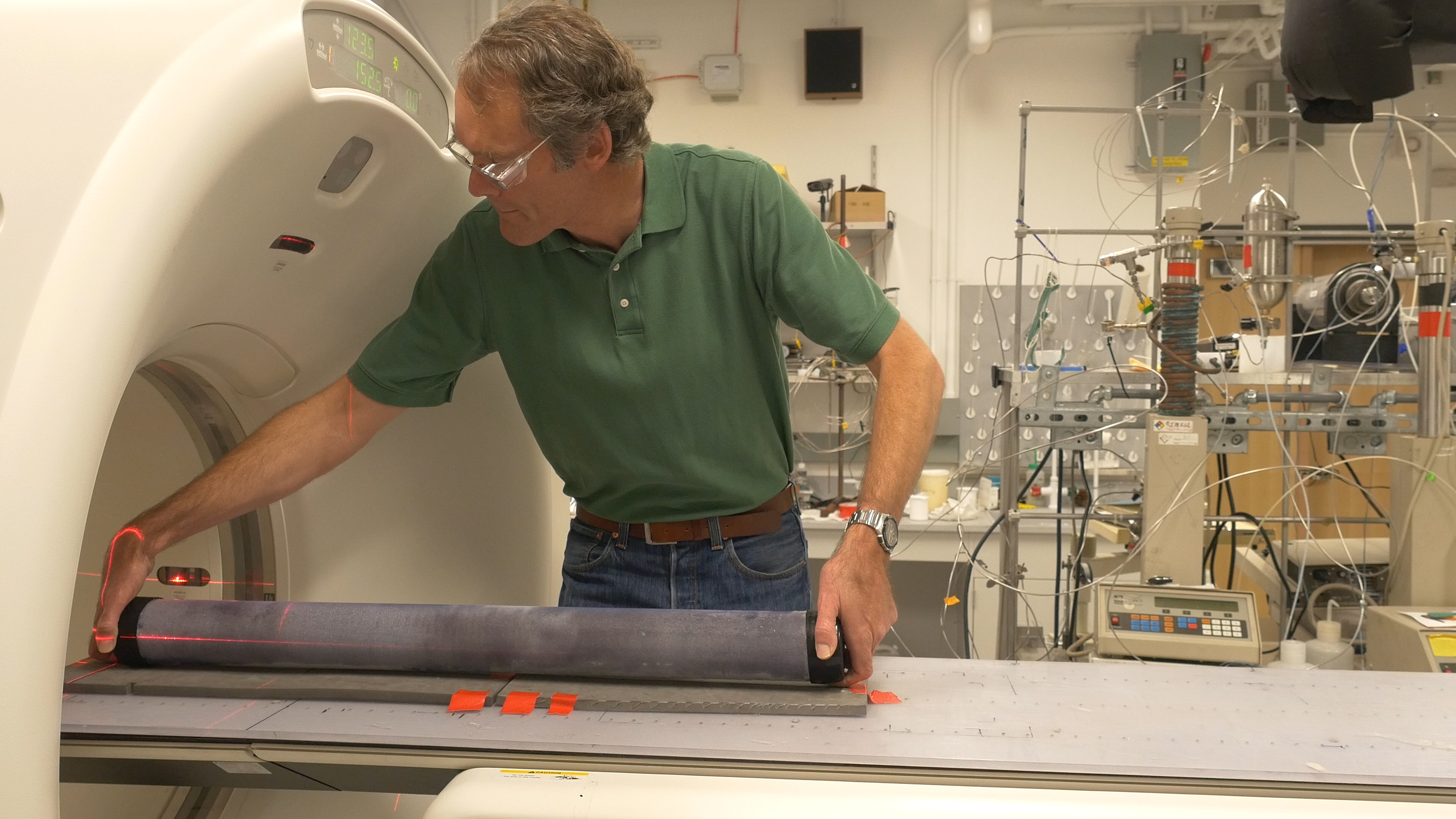Tim Kneafsey loading a permafrost core onto a CT scanner at LBNL. Photo: Josh Cassidy/KQED