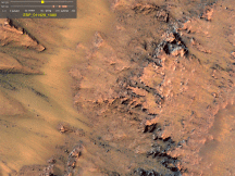 Flows of material running down the slopes of crater walls on Mars, captured by NASA's Mars Reconnaissance Orbiter. (NASA/JPL-Caltech/Univ. of Arizona)