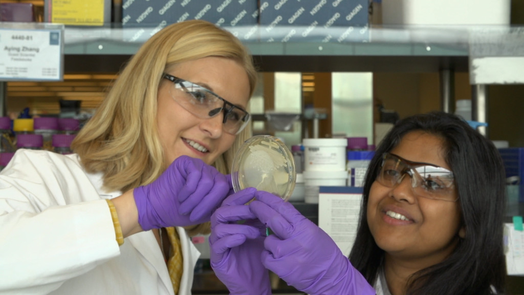 Aindrila Mukhopadhyay (right) is a staff scientist at Lawrence Berkeley National Laboratory and leads a biofuels and systems biology team that is 70 percent female, an unusual occurrence in her field. (Josh Cassidy/KQED)