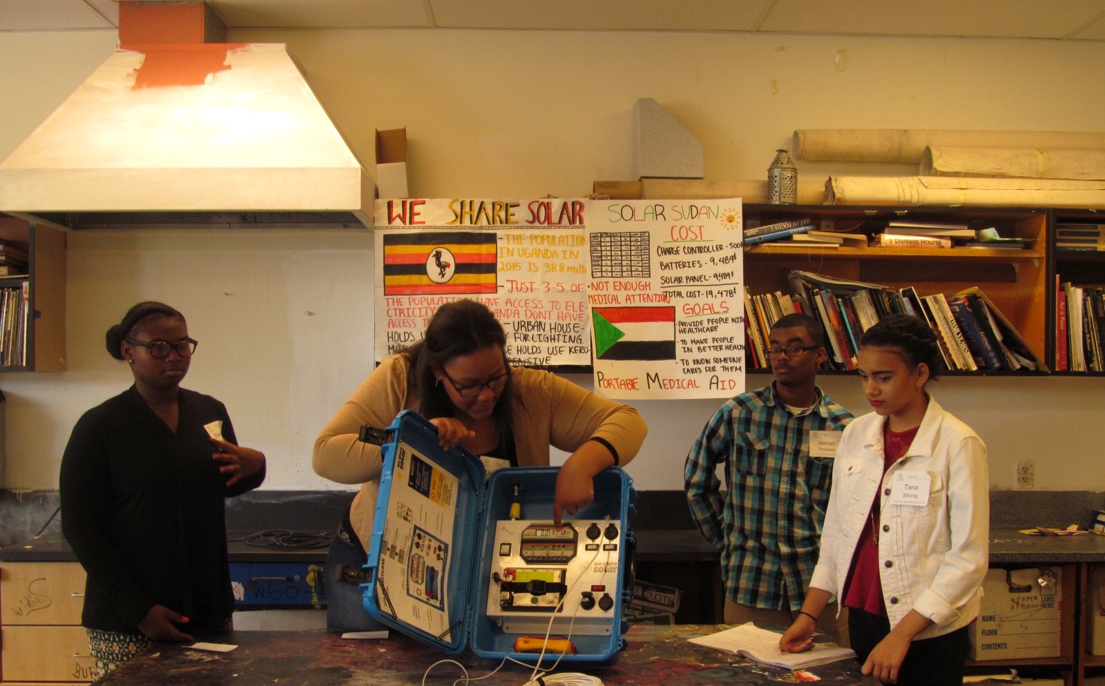 Skyline High School student Daijonne explains the capabilities of the solar suitcase that her group constructed.