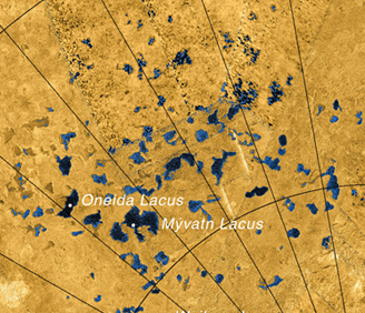 Alleged "sinkhole" lakes in the flat plains of Titan's polar region. (Cassini/NASA)