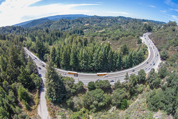 An aerial view of Laurel Curve shows how the highway dissects the Santa Cruz Mountains in two. Without connectivity, long-ranging species have trouble securing territory, mating, or finding food.  