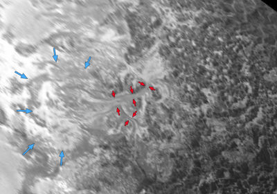 Blue arrows indicate a region of accumulated ices, while red arrows outline a feature believed to be formed by glacier flow activity. 