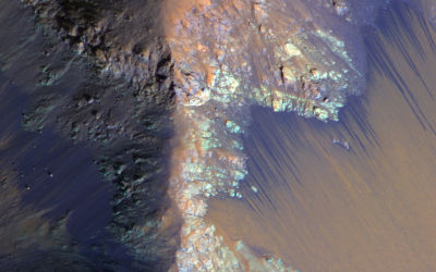 Recurring slope lineae (dark streaks) running down the slopes of the Martian canyon, Coprates Chasma. 