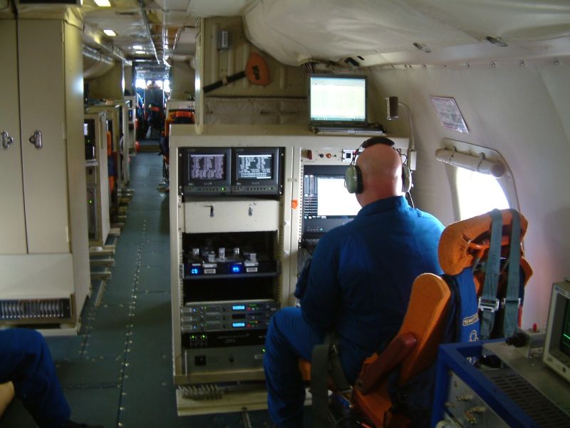 Research cubicles line the length of the plane, where scientists monitor variables like water vapor, wind direction and air pressure.